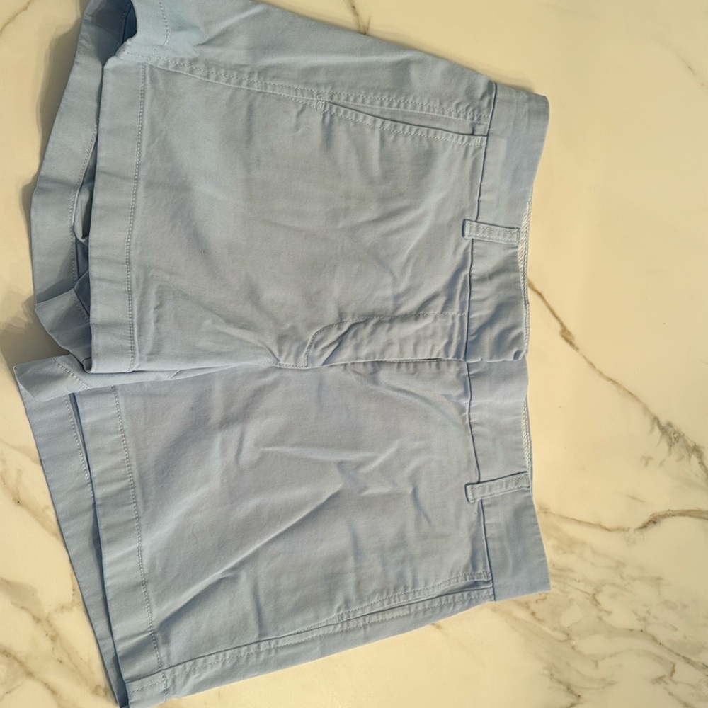 Light blue chino shorts.